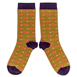 Pair of socks with red fox pattern on a green background