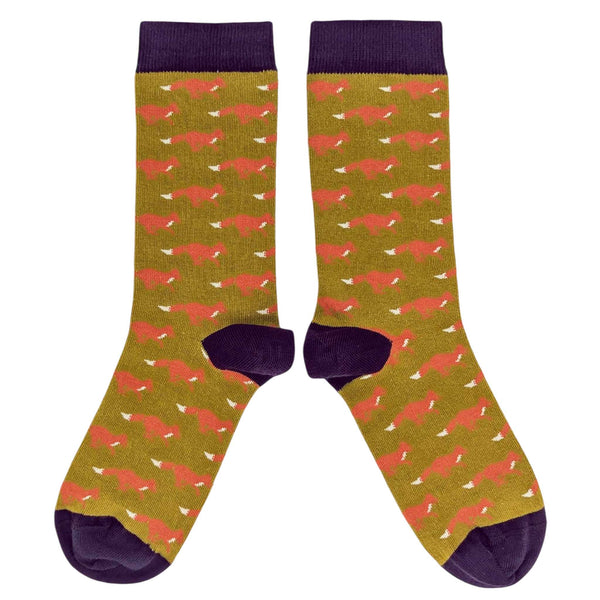 Pair of socks with red fox pattern on a green background