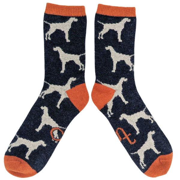 Pair of socks with dog pattern and orange accents on a white background