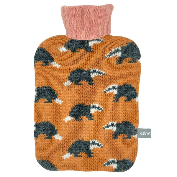 mini hot water bottle and 100% lambswool cover featuring badgers on an orange base