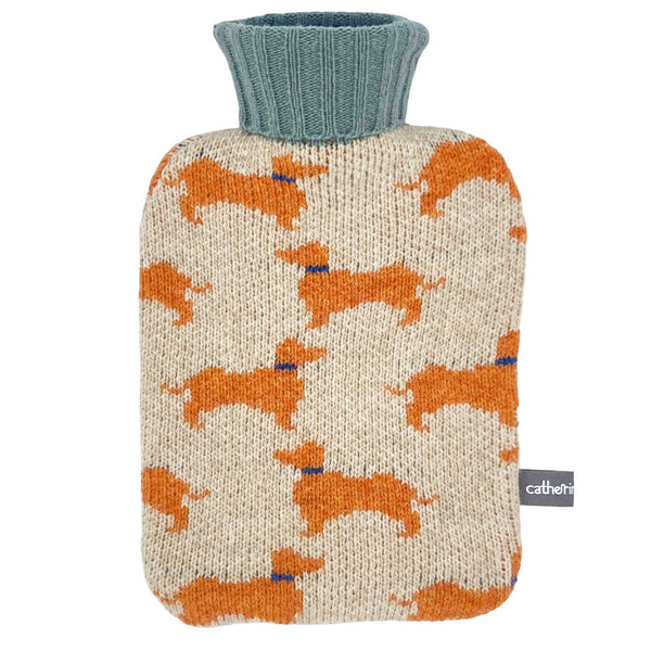 mini hot water bottle with a 100% lambswool cover featuring sausage dogs