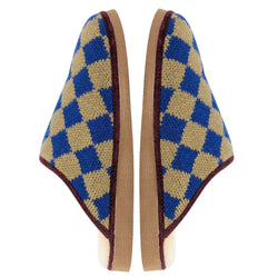 A pair of slip-on  catherine tough knit slippers with a blue and tan diamond pattern, featuring brown trim and a light beige footbed, shown against a plain white background.