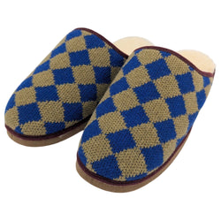 A pair of slip-on  catherine tough knit slippers with a blue and tan diamond pattern, featuring brown trim and a light beige footbed, shown against a plain white background.