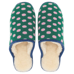 A pair of Catherine Tough knit slip-on slippers with a green background, pink polka dots, and blue trim, shown on a plain white background.