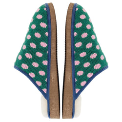 A pair of Catherine Tough knit slip-on slippers with a green background, pink polka dots, and blue trim, shown on a plain white background.