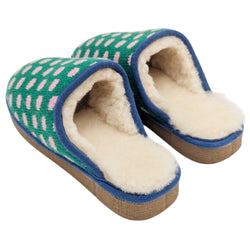 A pair of Catherine Tough knit slip-on slippers with a green background, pink polka dots, and blue trim, shown on a plain white background.