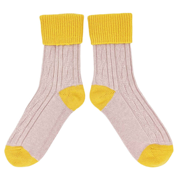 unisex cashmere mix socks with cable detail in  light pink with yellow cuffs