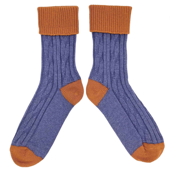 unisex cashmere mix socks featuring a cable knit design in purple with orange cuffs